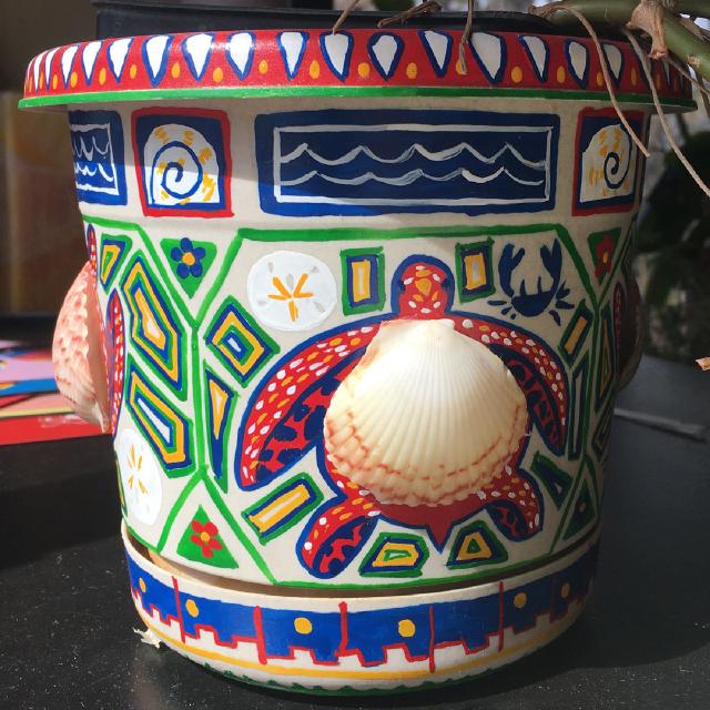 A flower pot decorated in enamel paints, inspired by the seashells we picked up on a visit to Florida in 2017.